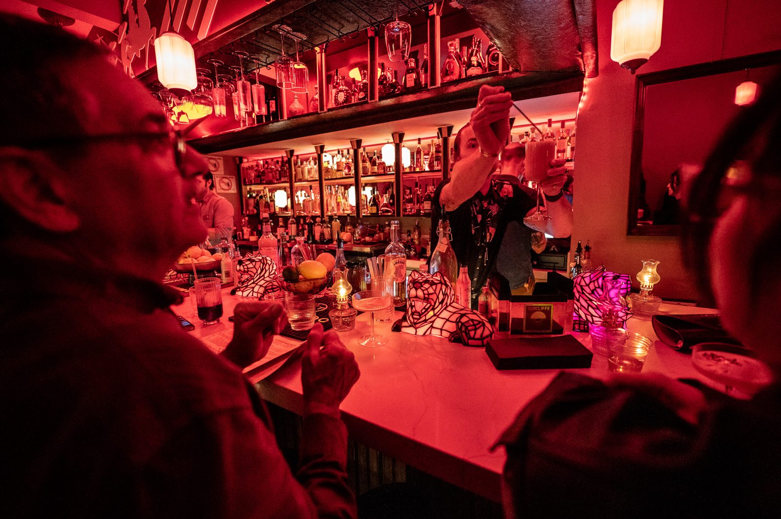 The red-lit back bar
