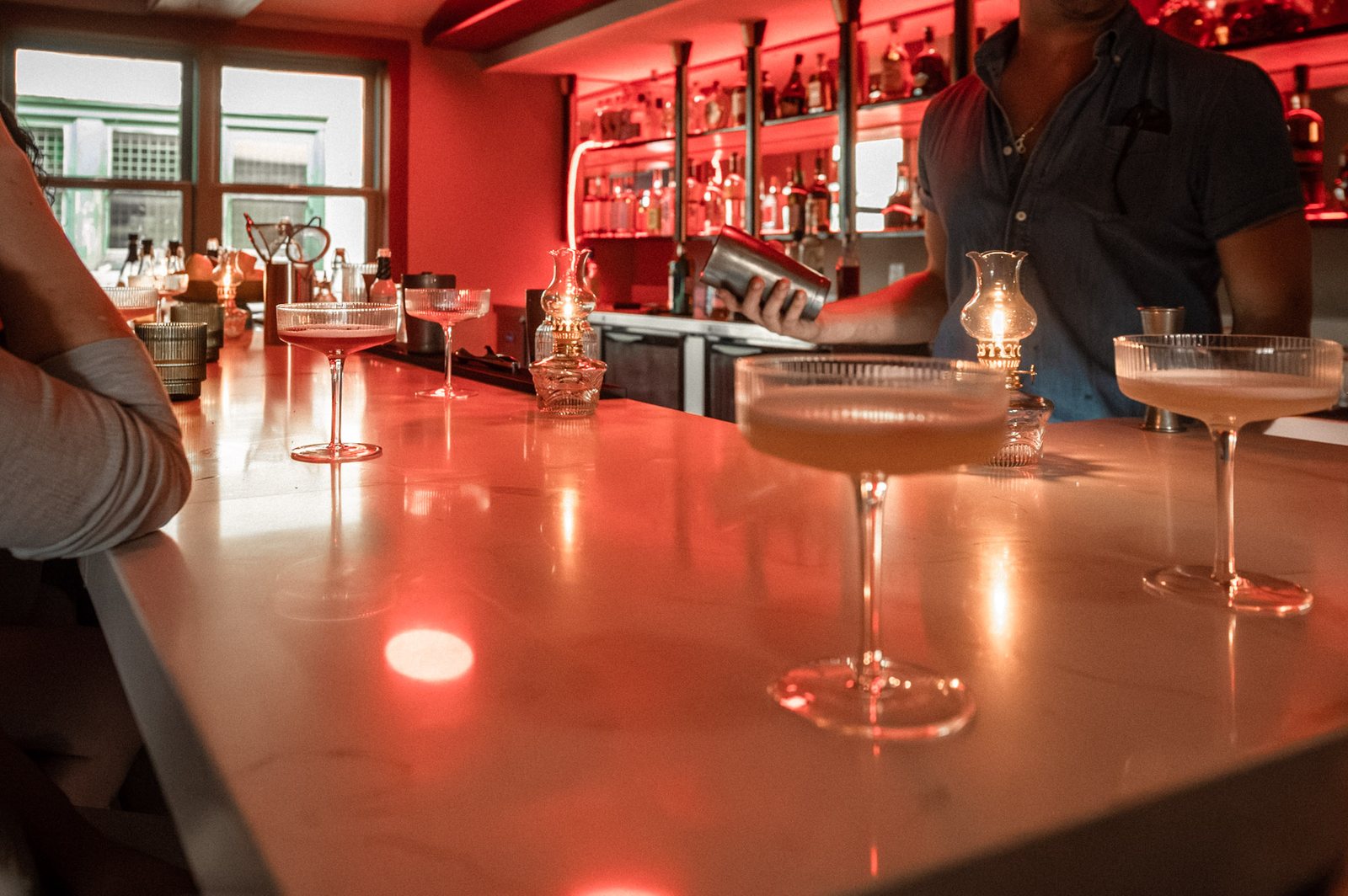 Brandylion bar under red light at night